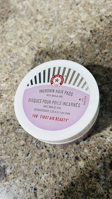Reviewer’s image showing a jar of First Aid Beauty ingrown hair pads