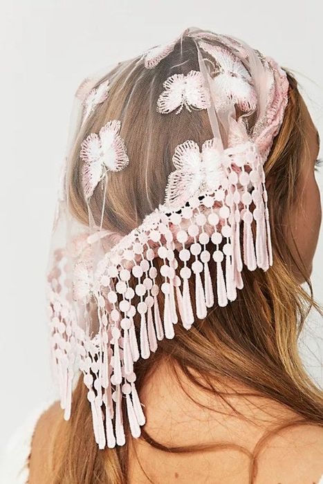 A model flaunting the Mina Hair Scarf.