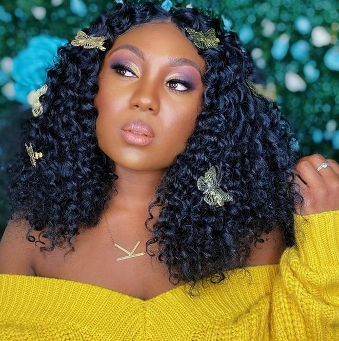 A picture from a reviewer featuring the gold butterfly hair clips.