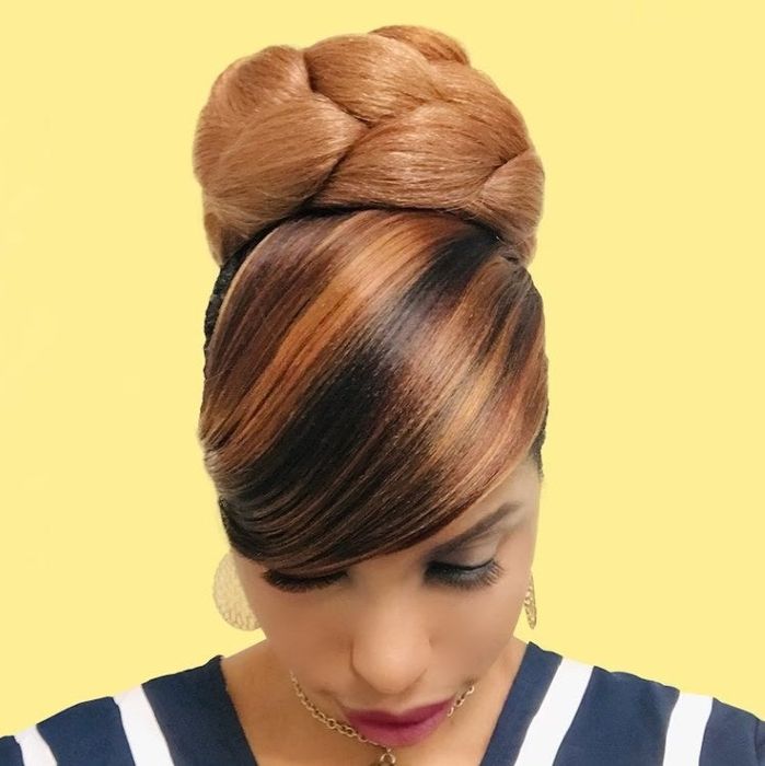 A model wearing the clip-on bun designed for natural hair.