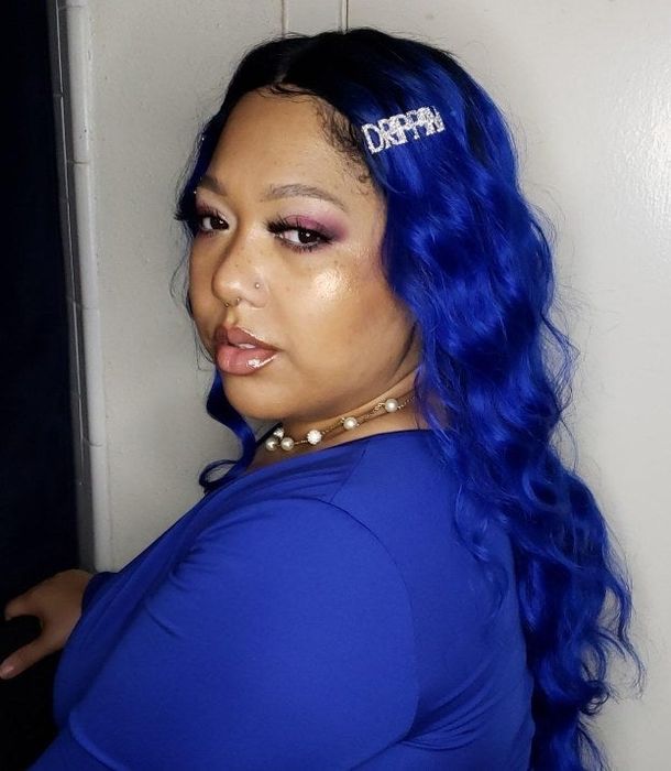 A reviewer sporting a chic drippin' hair clip.