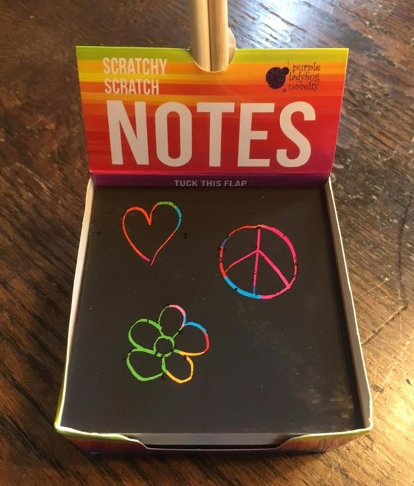 A photo from a reviewer showing a note with doodles, revealing the hidden color underneath as it’s scratched off.