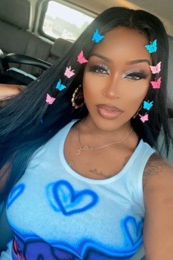 A reviewer showcasing the mini butterfly clip set in their hair