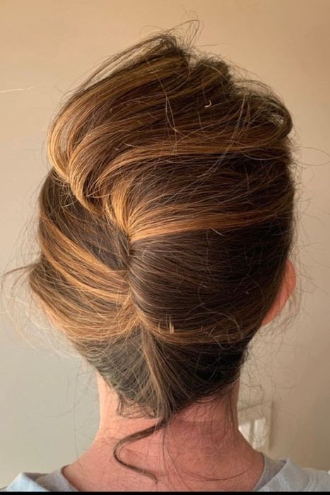 A model showcasing a French twist created with the Updo It clip.
