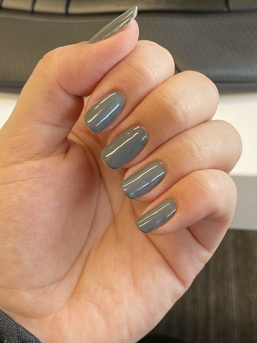 Reviewer's gel manicure in a stylish grey color.