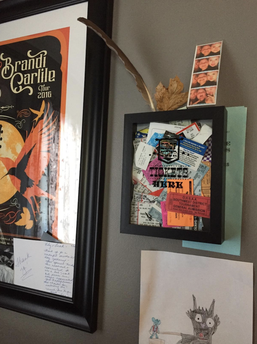 A reviewer’s photo of the ticket box mounted on the wall like a picture frame.