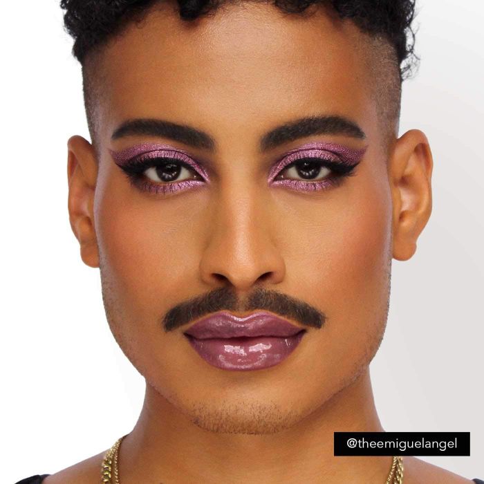 a model sporting shimmering purple eyeshadow
