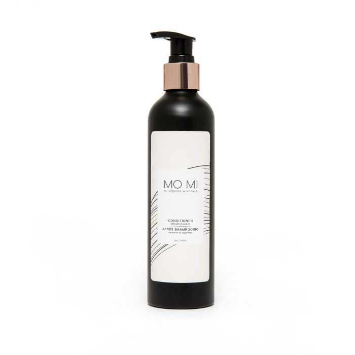 Product image of the conditioner in a sleek black bottle with a pump.