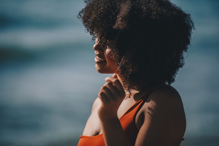 a model showcasing thick, curly hair