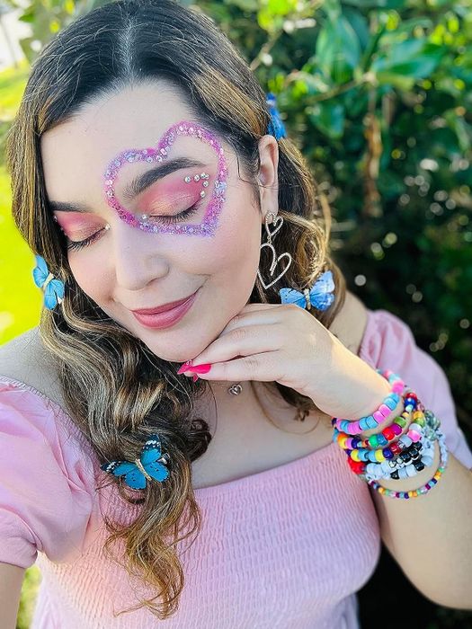 A reviewer sporting a pink glittery heart shape around their eye