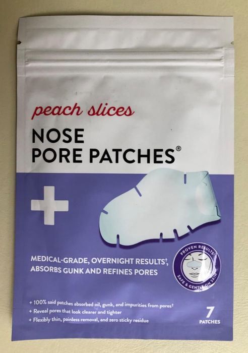 A reviewer's photo showcasing the pack of nose strips.