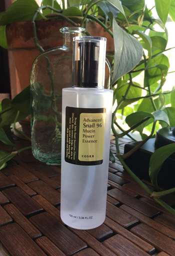 The bottle of Cosrx snail mucin repairing essence serum, ready to work its magic