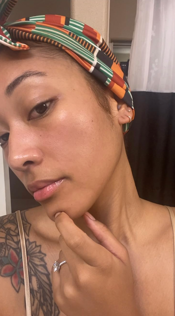 Reviewer's glowing, clear skin after using the skin spatula.