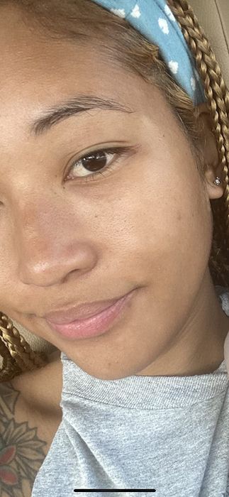 A reviewer with clear, glowing skin