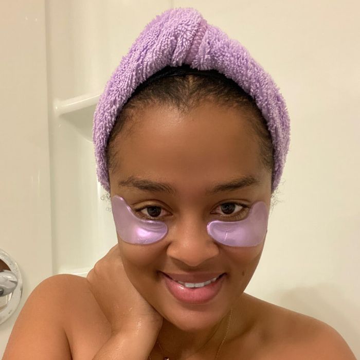 reviewer wearing the purple eye masks