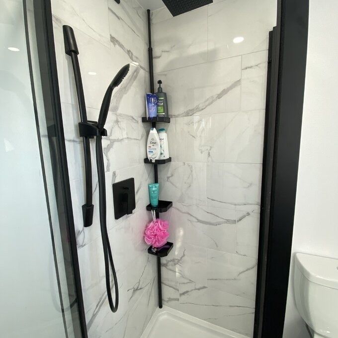 A variety of review images showcasing the shower rod installed in a shower.