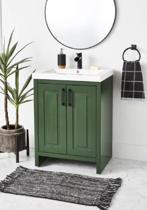 a sleek dark green bathroom vanity with under-sink storage
