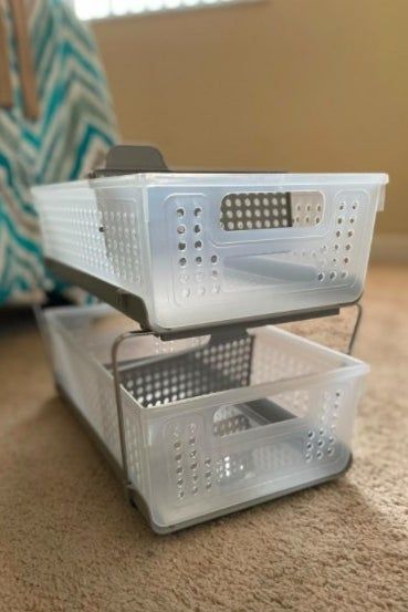 reviewer's empty stacked slide-out storage containers ready for use