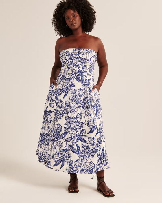 A model wearing a strapless linen dress with a blue and white pattern