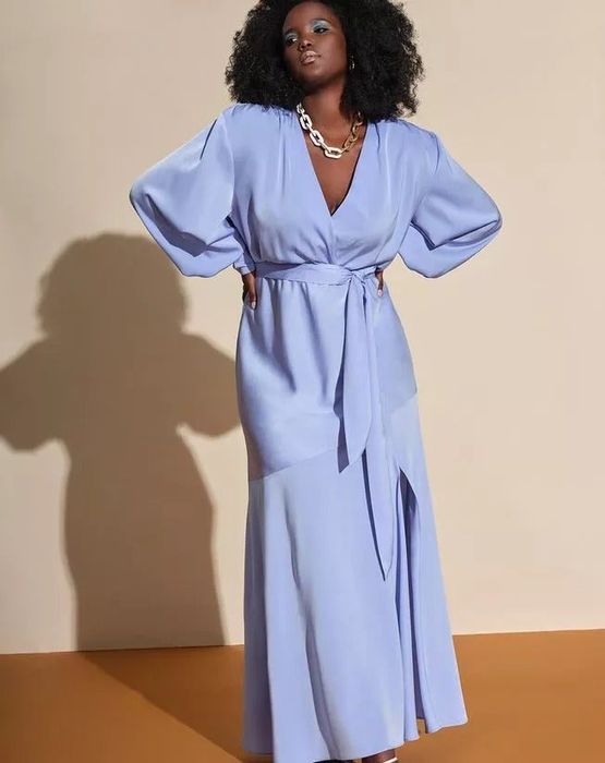 A model wearing the stunning periwinkle blue satin maxi dress.