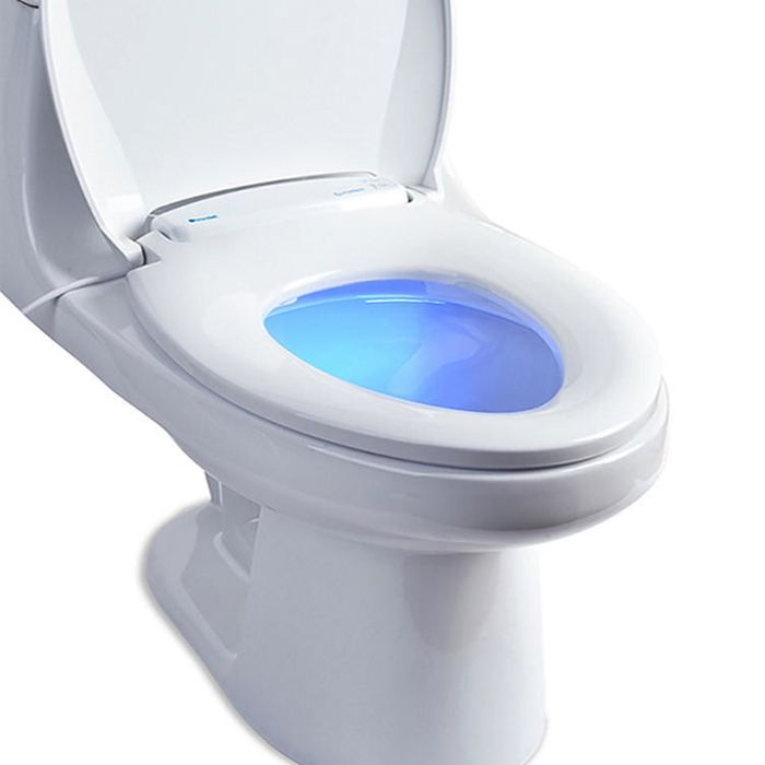 A white heated toilet seat emitting a soft blue glow.