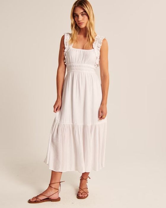 model showcasing the dress in a crisp white hue
