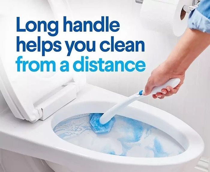 a person using the Clorox ToiletWand Disposable Toilet Cleaning System to scrub a toilet