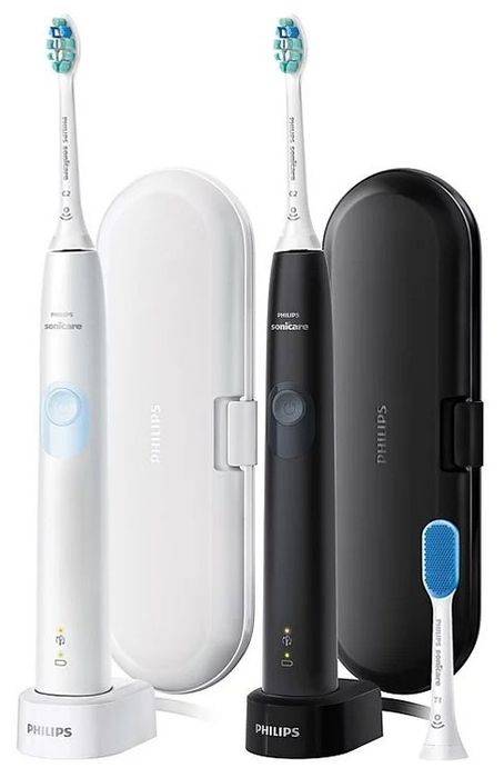 A set of black and white electric toothbrushes with a convenient carrying case.