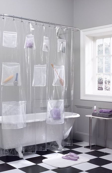 clear shower curtain with pockets storing bathroom necessities