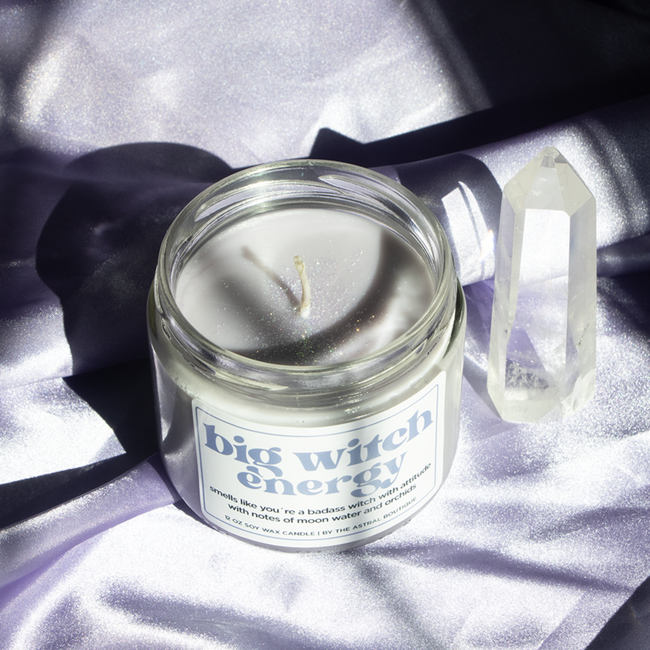 A glass candle jar with the label that reads