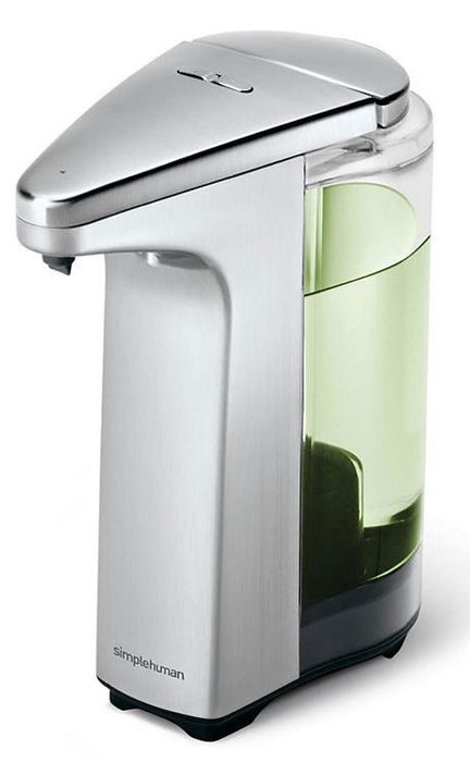 A sleek silver and clear sensor soap dispenser filled with green liquid soap.