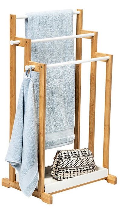 a three-tier wooden towel rack with a bottom shelf