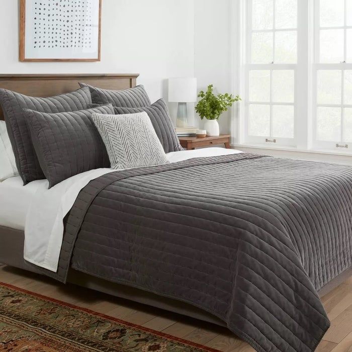 bed adorned with quilt