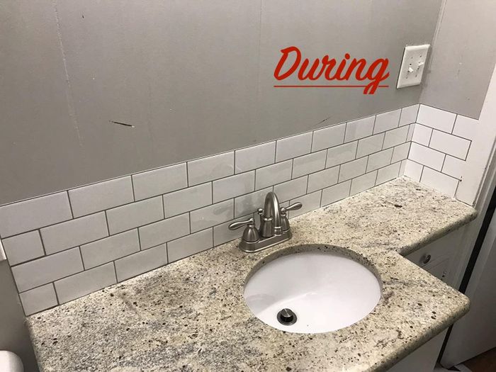 The bathroom in the middle of the tile installation process