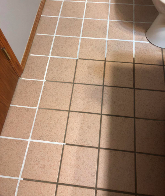 A customer's photo showing the progress of their grout restoration project.