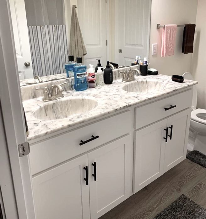 The reviewer’s bathroom features sleek black cabinet pulls.