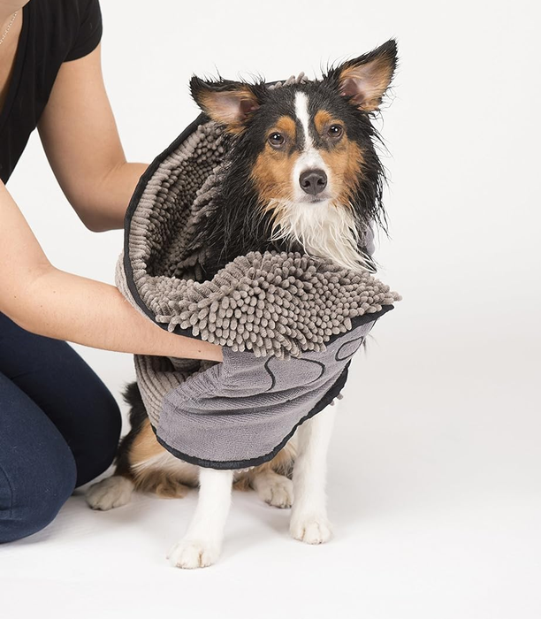 A model demonstrating the use of the shammy to dry off a wet dog.