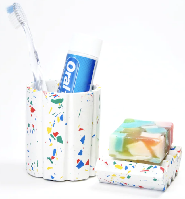 The toothbrush and soap holder are showcased