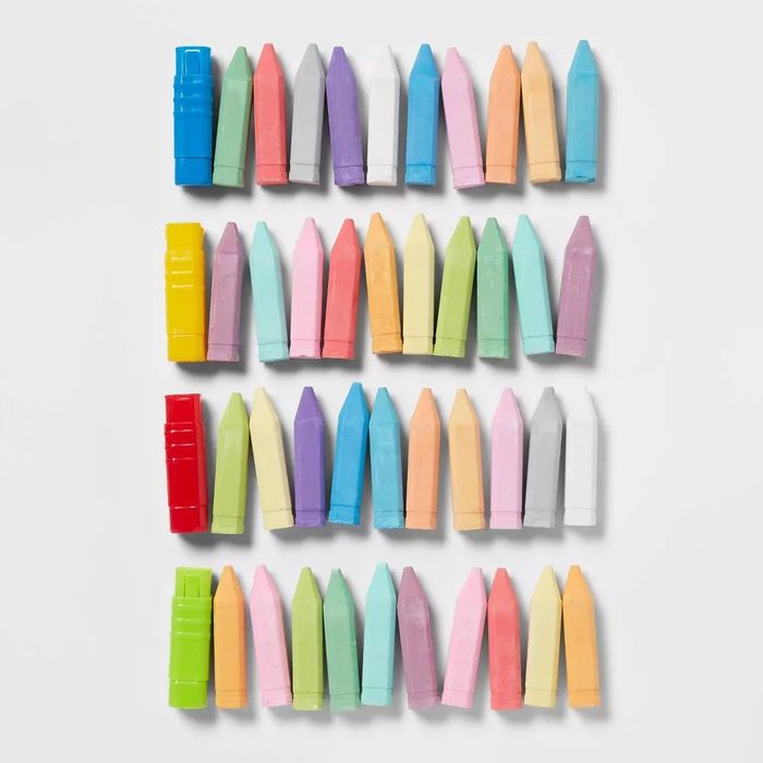A variety of colorful chalk pieces laid out ready for creative use.