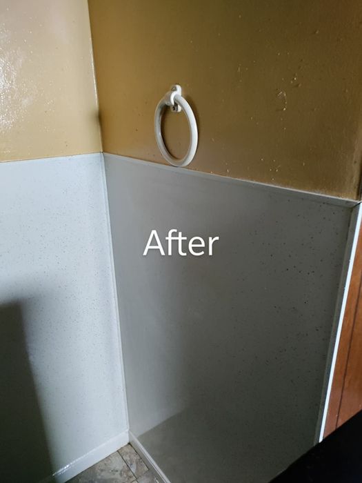 The same wall after cleaning, now completely free of stains.