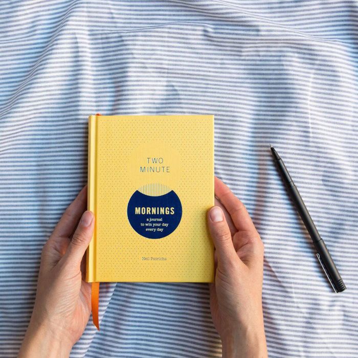Hands holding the book