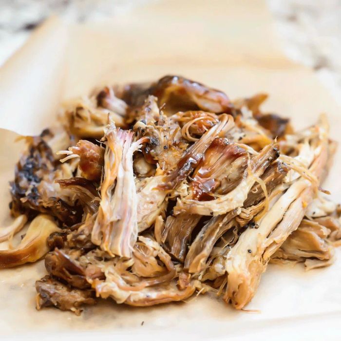 Tender, shredded pork generously coated in a glossy, flavorful BBQ sauce