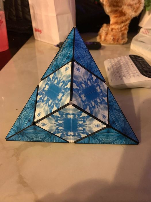 A fidget cube folded into geometric triangular shapes, as shown by the reviewer.