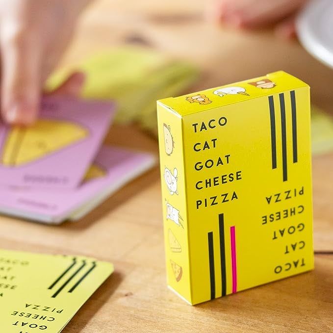 The game box or cards placed alongside a spread of loose cards from the deck.