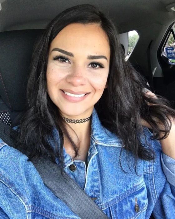 A reviewer showcasing shoulder-length brunette hair