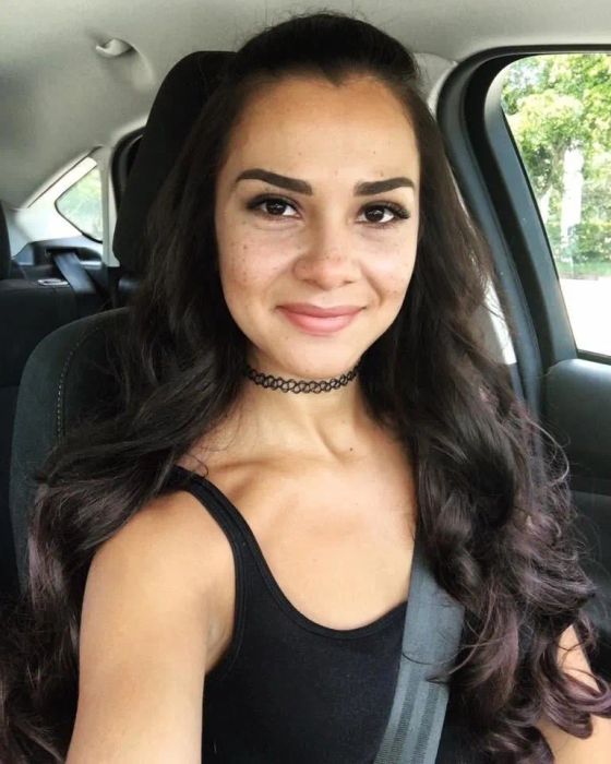 The same reviewer flaunting long, voluminous hair after adding the extensions