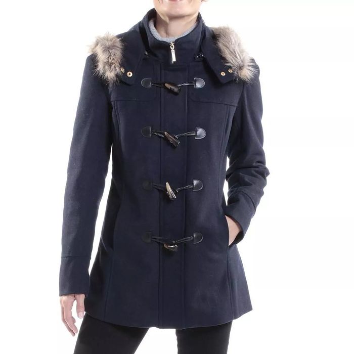 a model wearing a navy blue coat