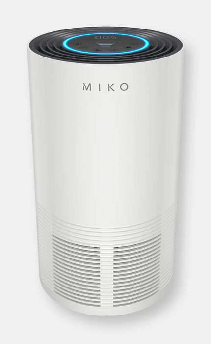 The air purifier in white, glowing blue at the top when in use.