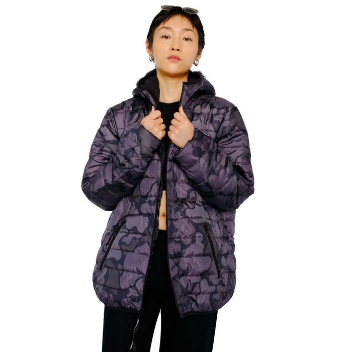 A person is wearing a black camo puffer coat.