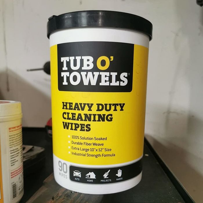 A yellow and black Tub O' Towels.